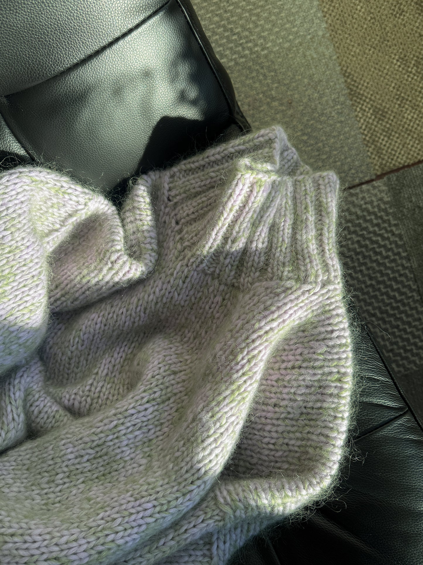 Close-up of a textured fabric with a neutral color palette.