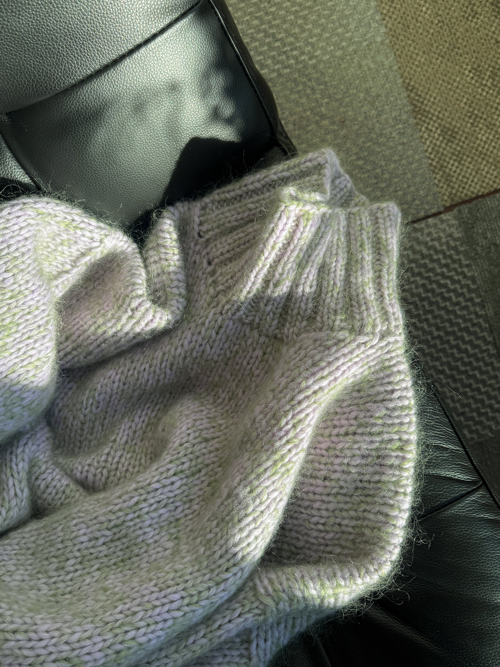 Close-up of a textured fabric with a neutral color palette.