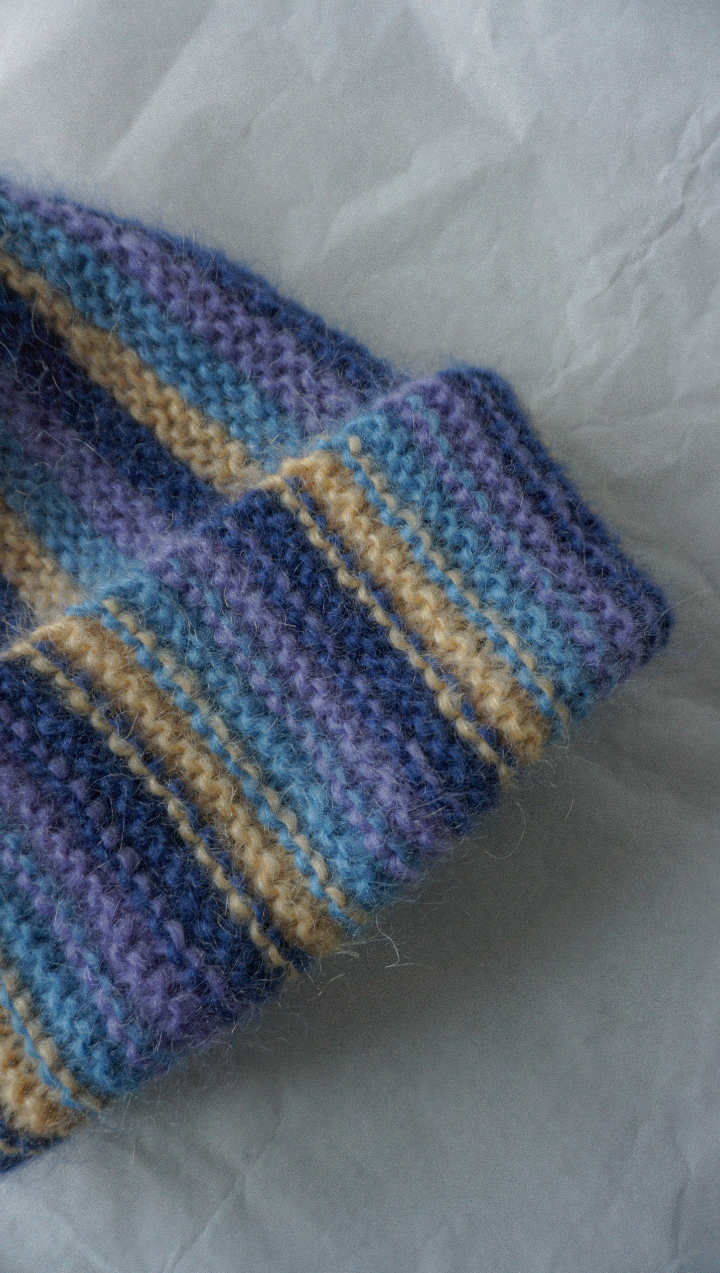 Colorful mohair beanie in blue purple and yellow stripes