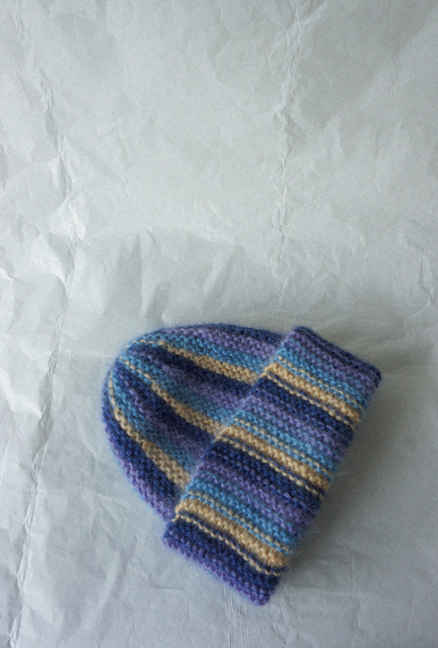 Colorful mohair beanie in blue purple and yellow stripes