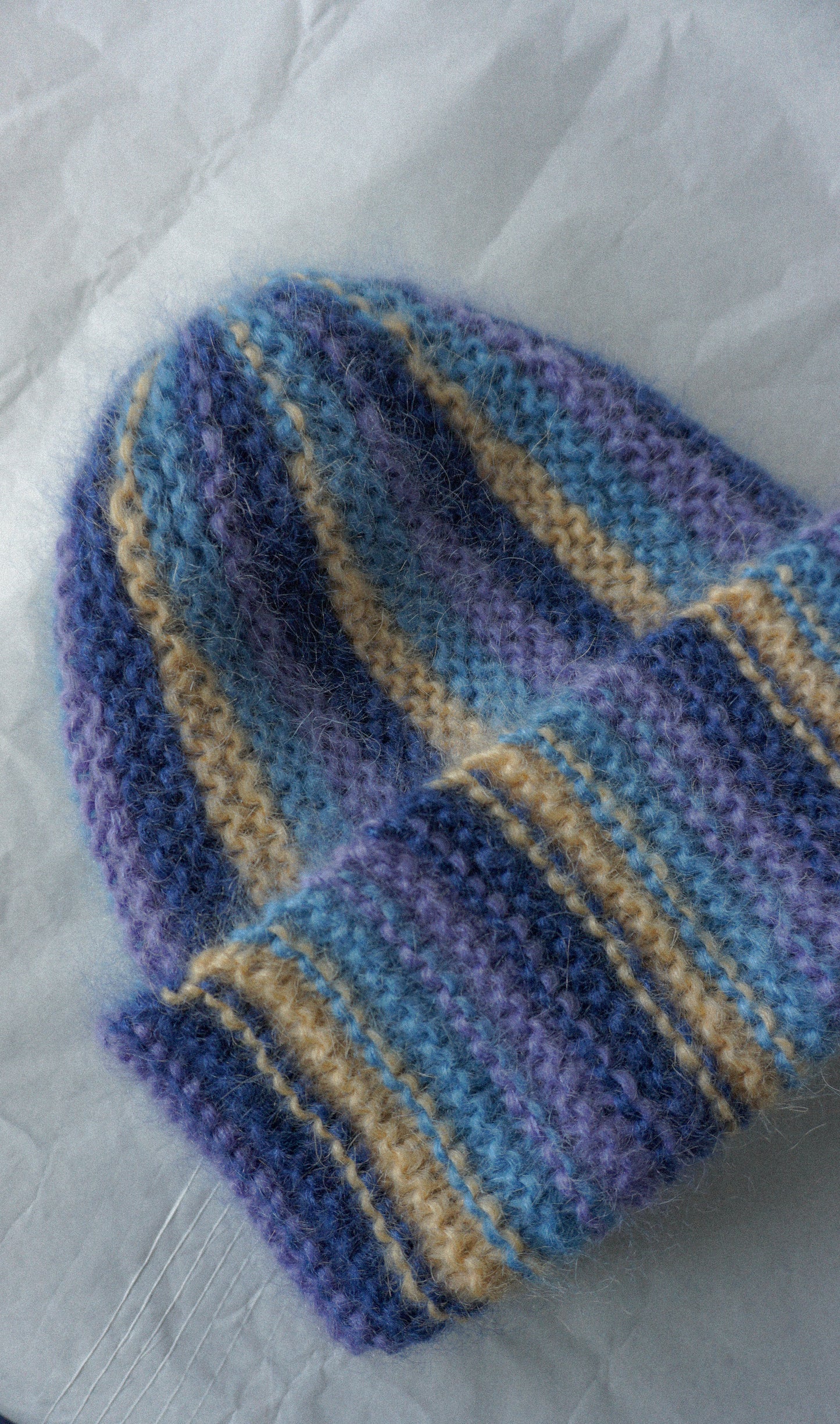 Colorful mohair beanie in blue purple and yellow stripes