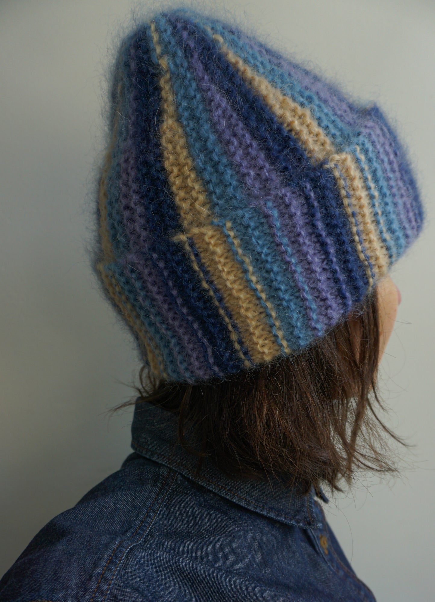 Colorful mohair beanie in blue purple and yellow stripes