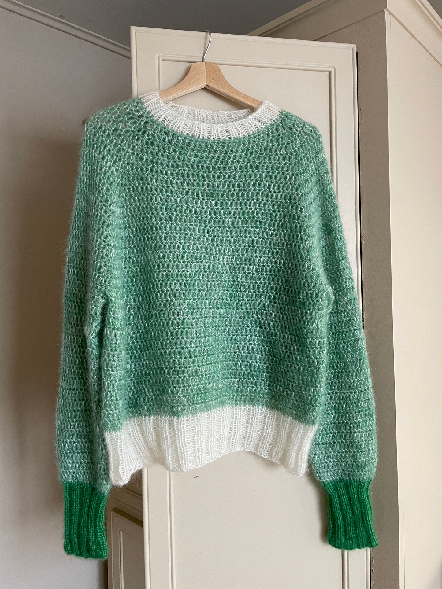 Melange white green crochet mohair sweater with contrasting cuffs